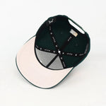 Green cap  grey under visor with embroidered details on a white background
