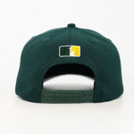 Green baseball cap with the WOA Liberty logo on the back against a white background