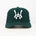Green baseball cap with a white WA logo on a white background