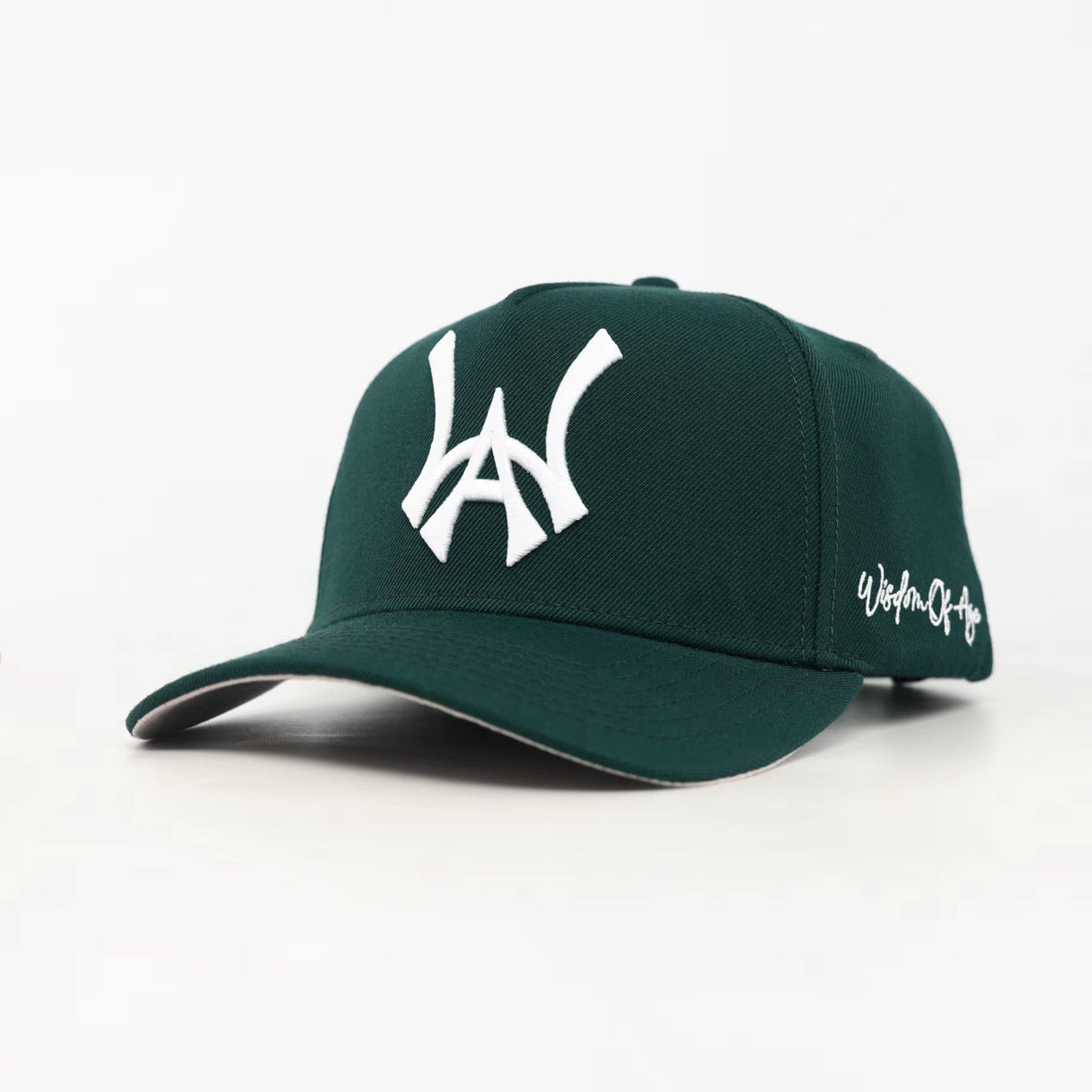 Green baseball cap with a white WA logo on a white background