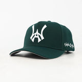 Green baseball cap with a white WA logo on a white background
