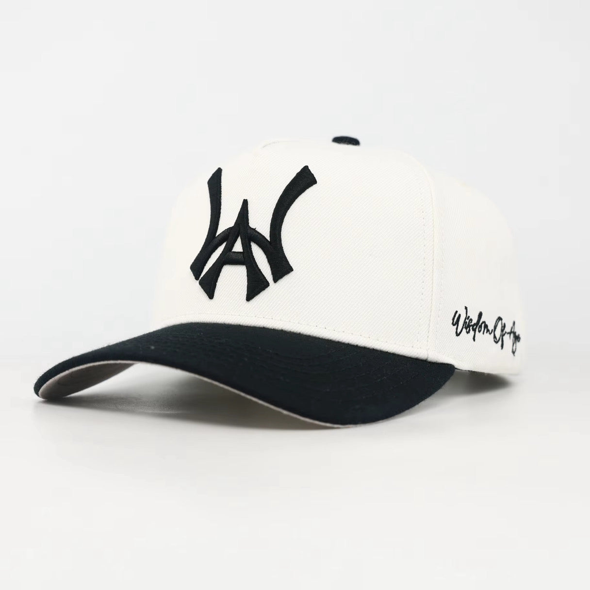 White and Black baseball cap with a Black WA logo on a white background
