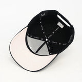 Under Visor of the WA Black cap with text on a white background