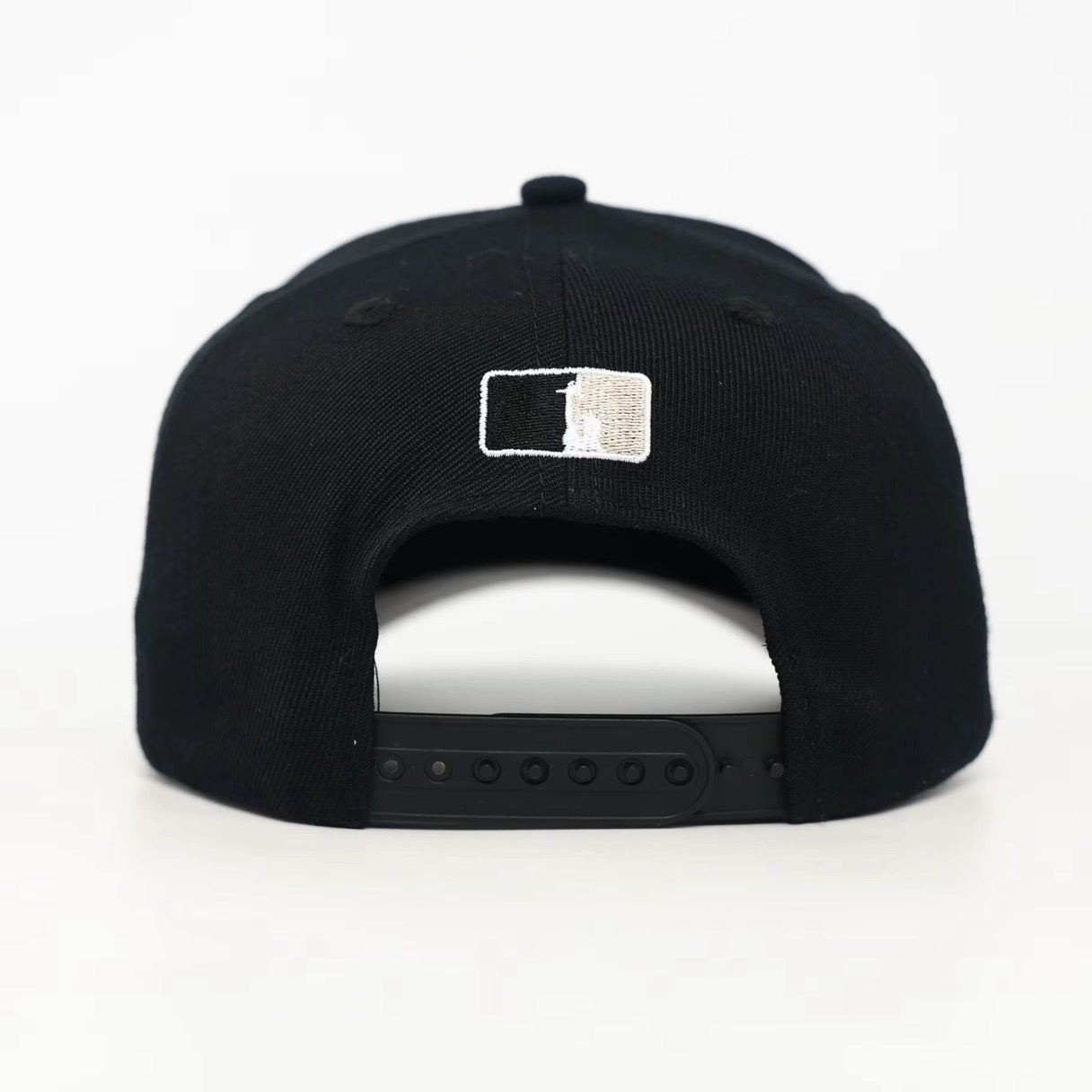 Black snapback cap with the WOA Liberty logo on the back against a white background