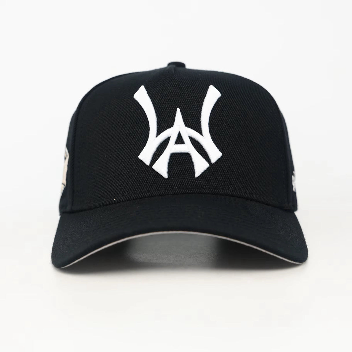 Black baseball cap with a white WA logo on a white background