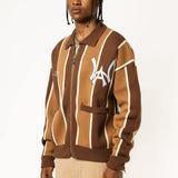 Male model wearing the WOA Knitted Brown and beige striped cardigan with WA logo on the left chest and 'Wisdom Of Age' written in script on the right chest on a white background.