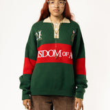 Female Model wearing a green and red, knitted rugby sweater with 'Wisdom of Age' text on a white background