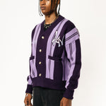 Front-side View Of a Male Model wearing WOA Knitted purple cardigan on a white background.