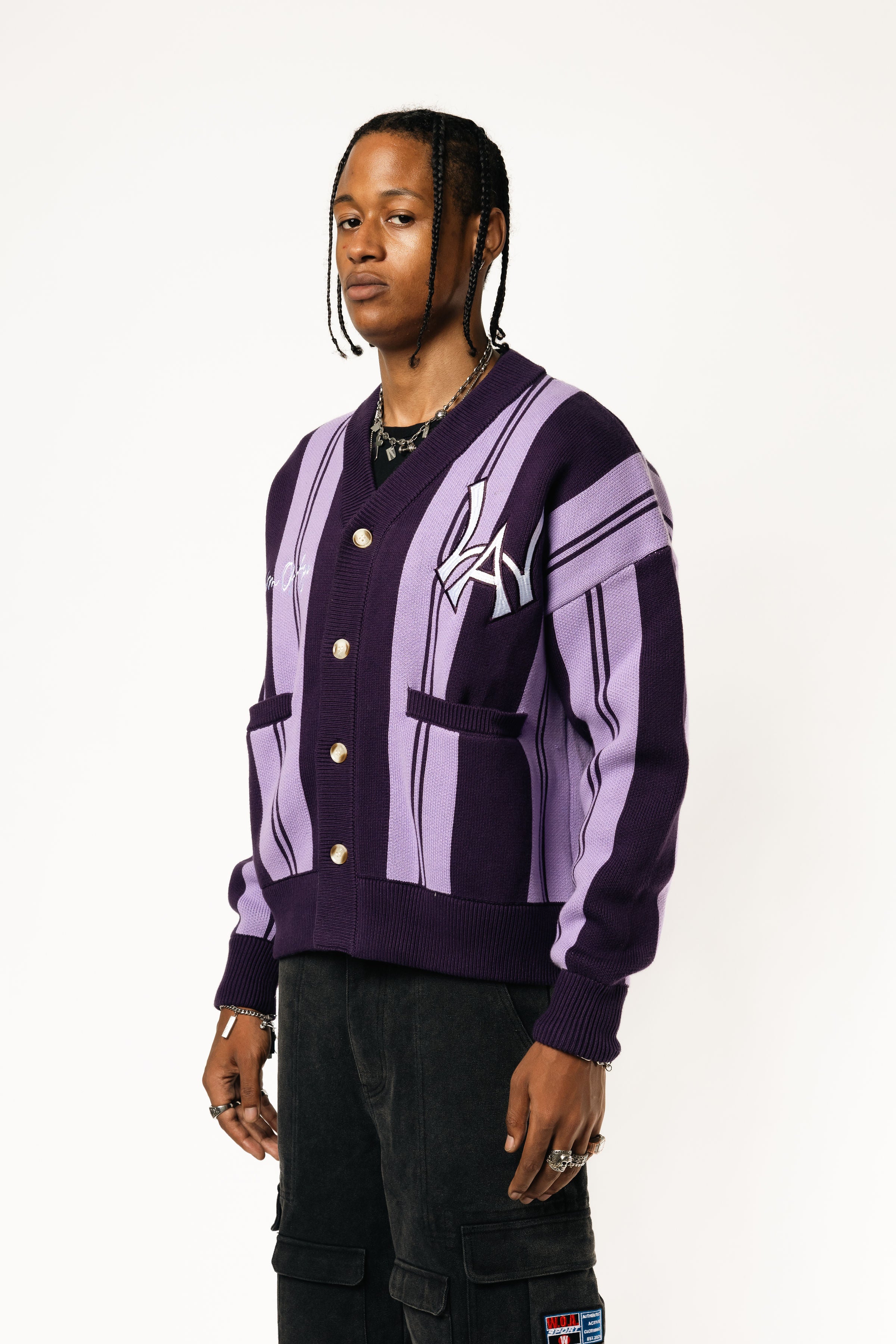 Front-side View Of a Male Model wearing WOA Knitted purple cardigan on a white background.