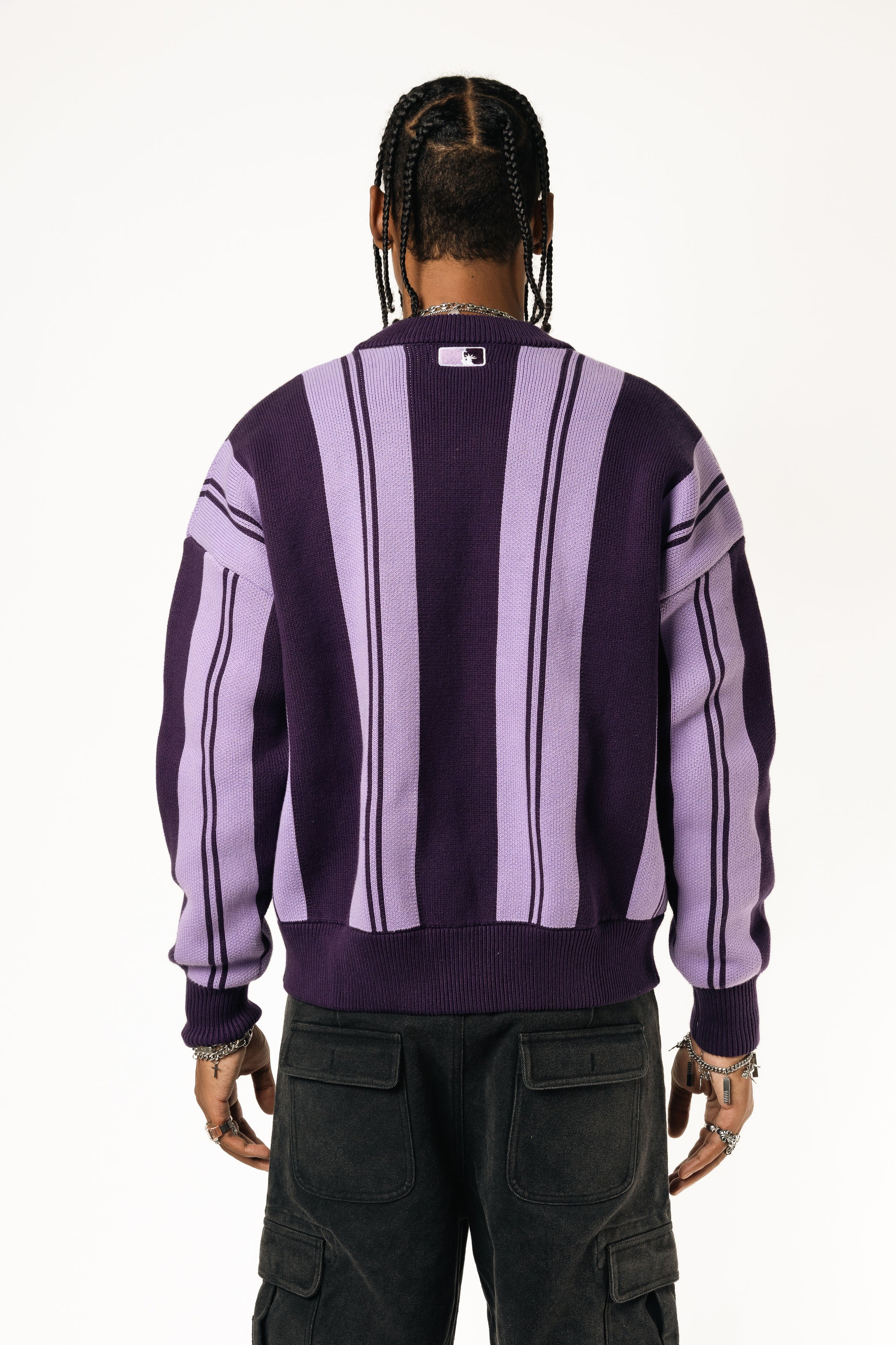 Rear View Of a Male Model wearing WOA Knitted purple cardigan on a white background.