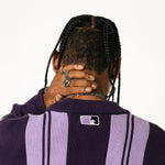 Close up rear View Of a Male Model wearing WOA Knitted purple cardigan on a white background.