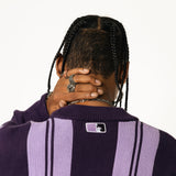 Close up rear View Of a Male Model wearing WOA Knitted purple cardigan on a white background.
