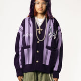 Front View Of a female Model wearing WOA Knitted purple cardigan on a white background.