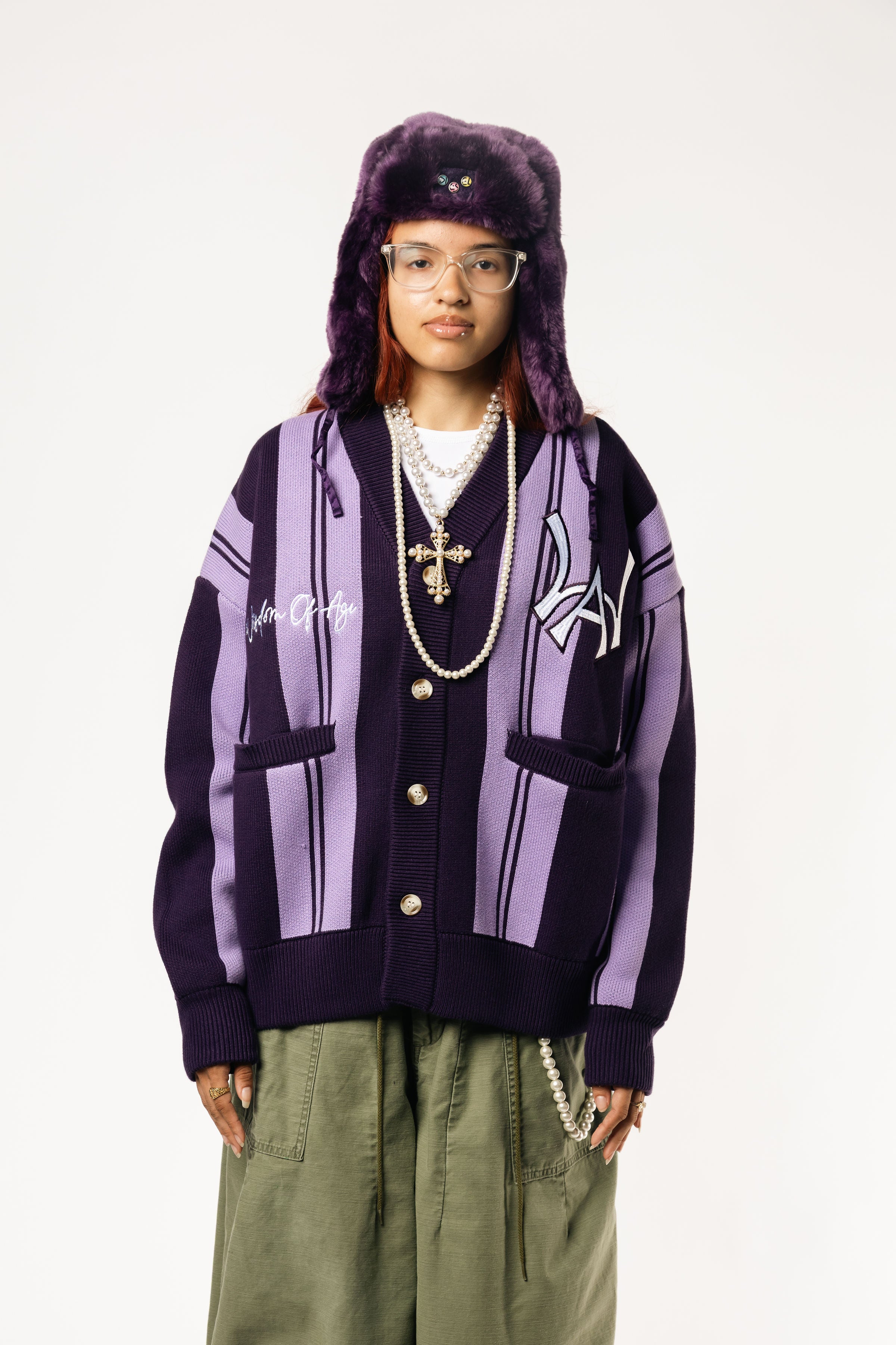 Front View Of a female Model wearing WOA Knitted purple cardigan on a white background.