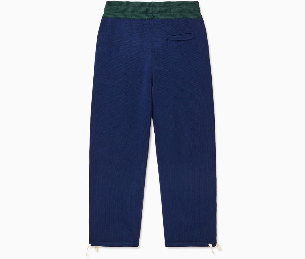 The Wisdom Of Age Knit Clinton Sweatpants Navy Rear View with a dark green waistband.