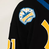 Close up of the Wisdom of Age liberty patch featuring the NYC skyline.
