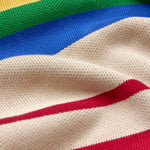 Close-up of a multicolored striped fabric with red, white, blue, green, and yellow.