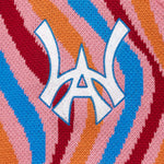 Close-up of a colorful fabric with the WA in the center