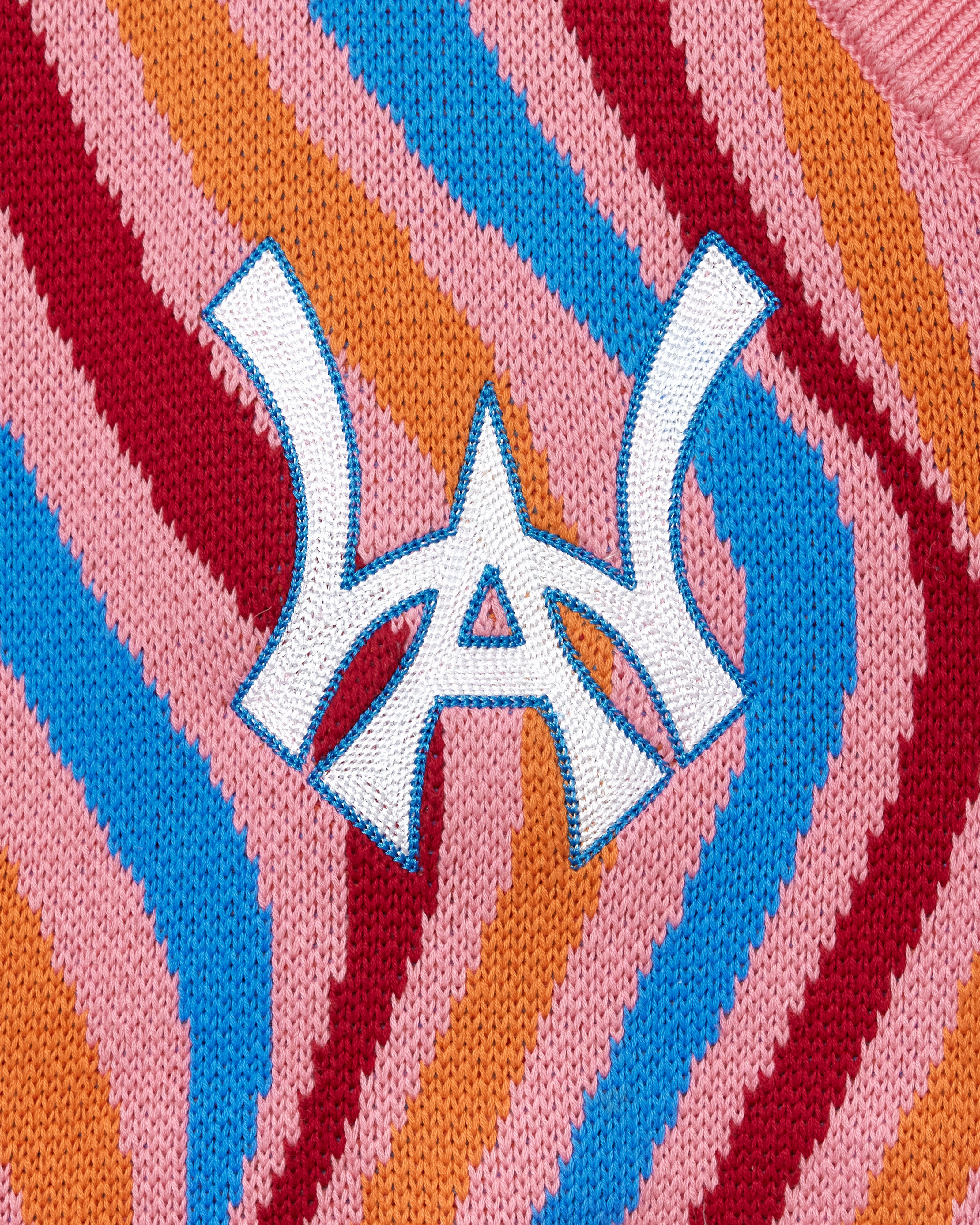 Close-up of a colorful fabric with the WA in the center