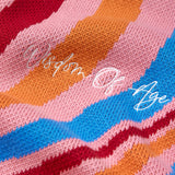 Colorful fabric with 'Wisdom of Age' embroidery