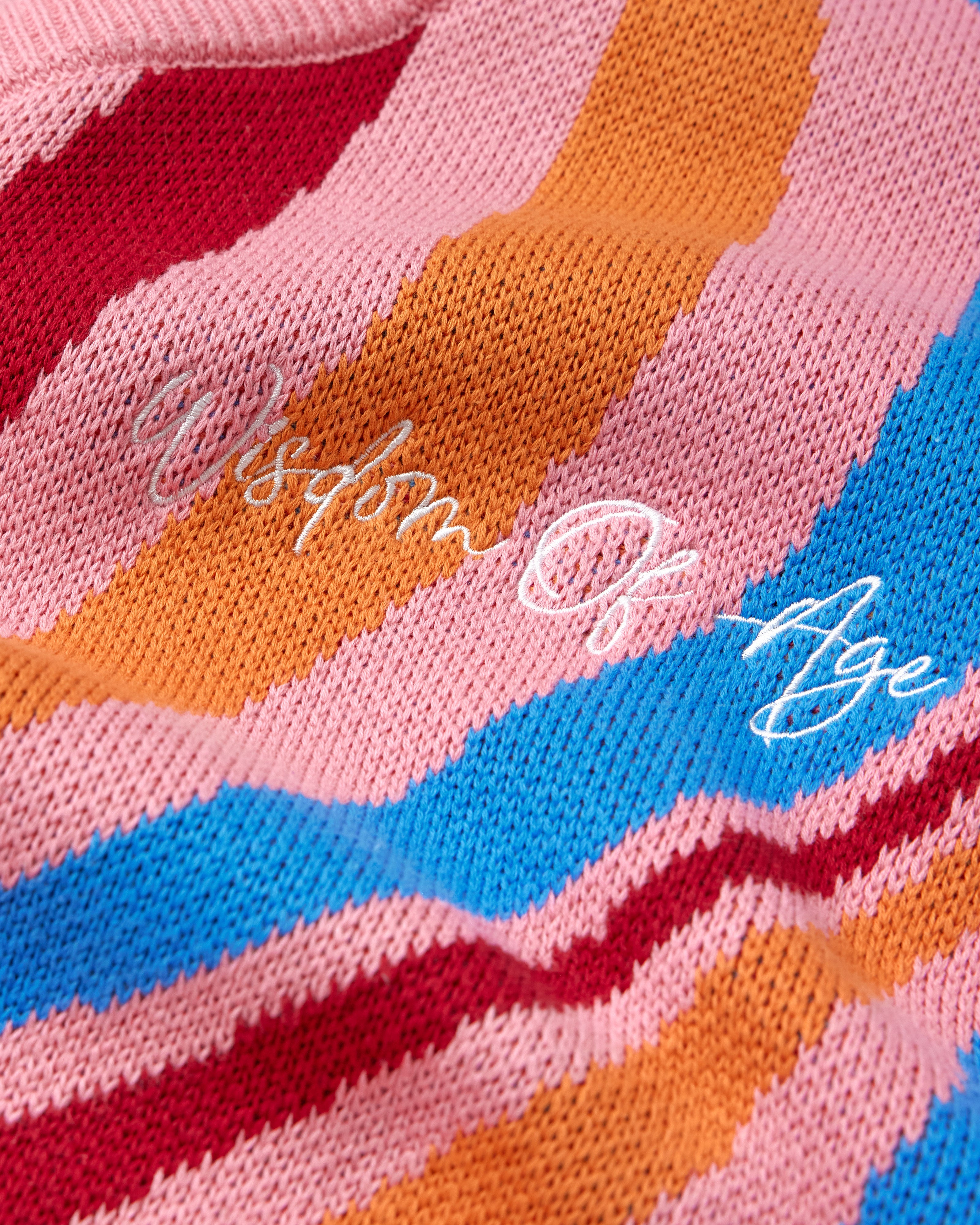 Colorful fabric with 'Wisdom of Age' embroidery