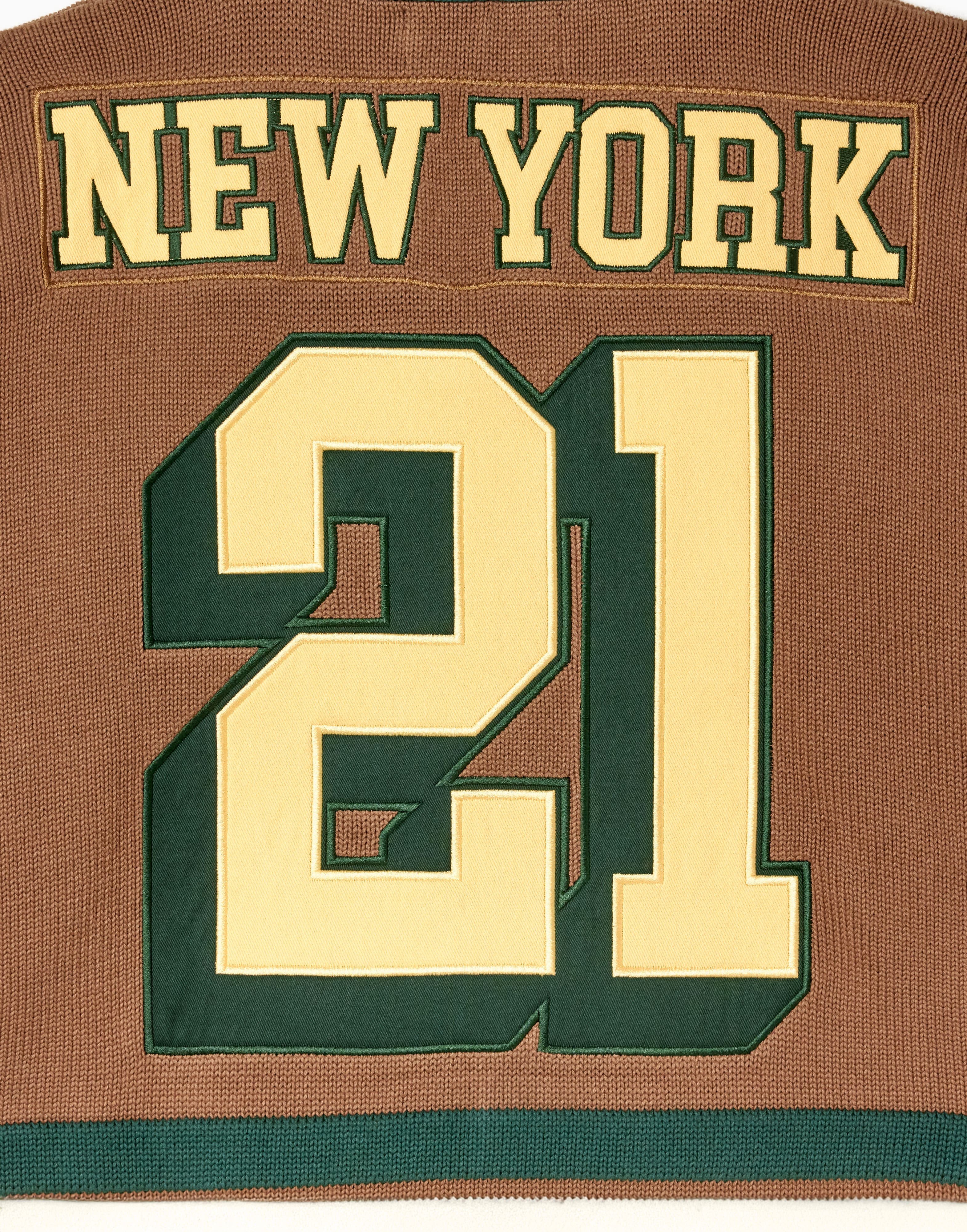 Close up of the back of the WOA Hockey Jersey in Autumn. 'New York' on the name plate and number '21' 
