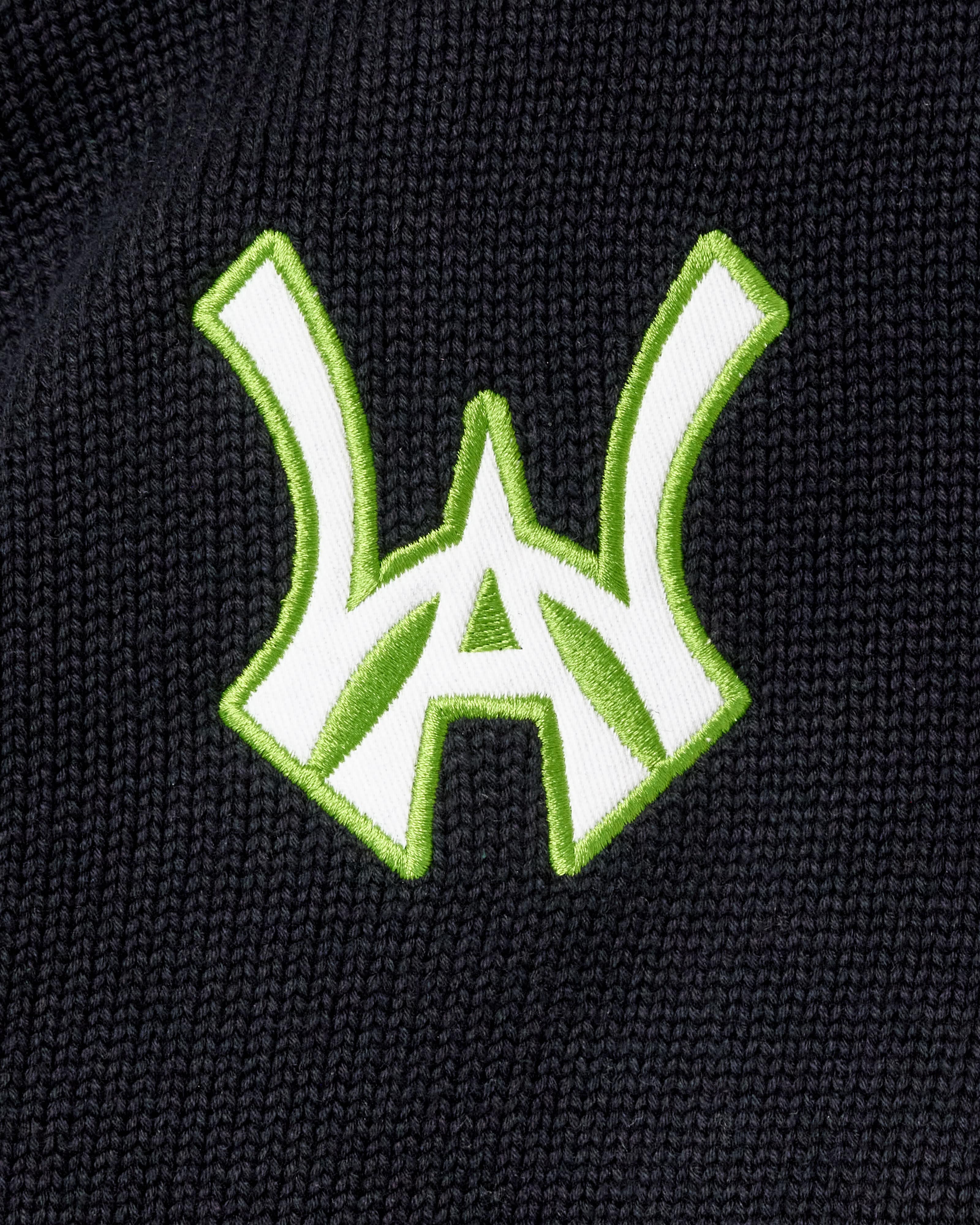 WA logo in white with a neon green outline
