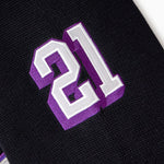Black sleeve with purple and white number '21' on a white background