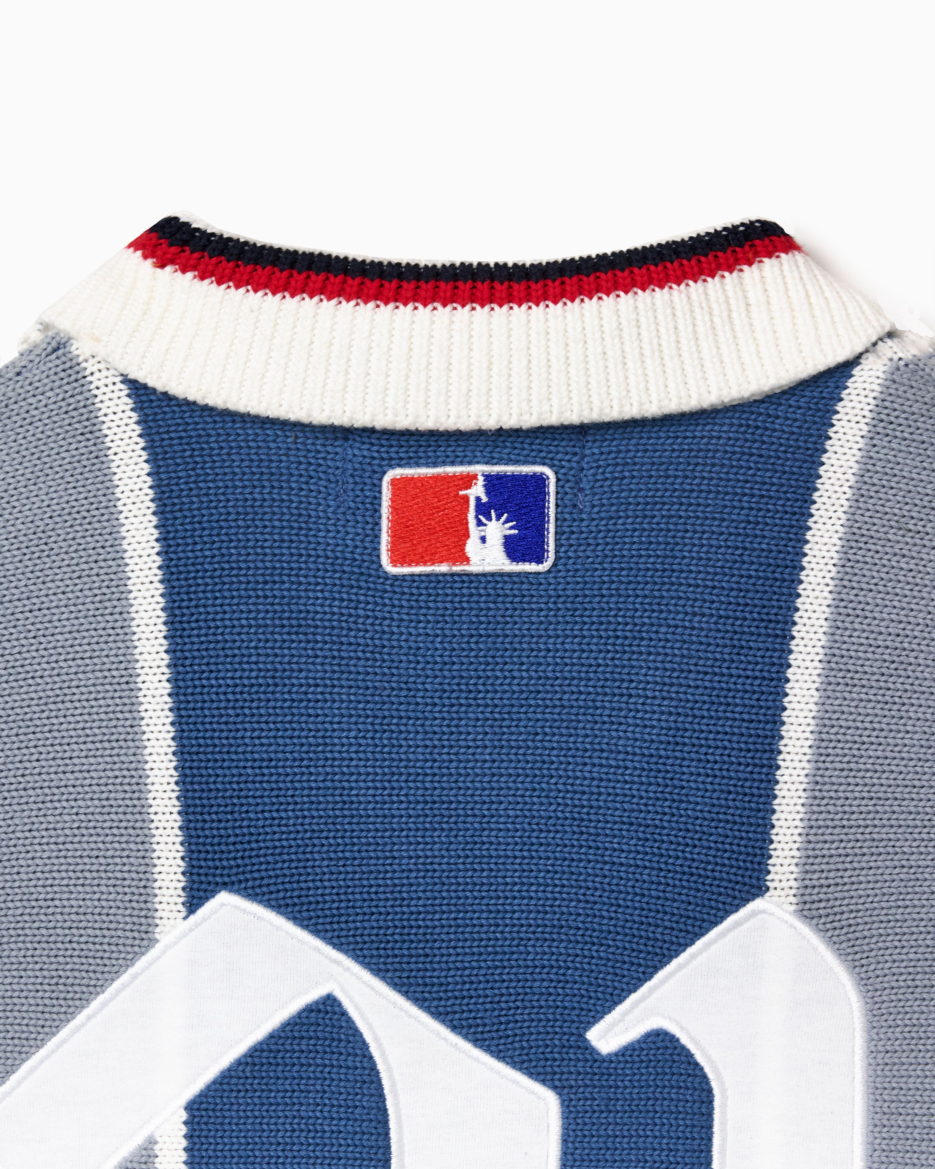 Close up on the collar of the Wisdom Of age knitted soccer jersey grey stripe