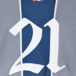 Close-up of a knitted soccer jersey with number 21 and 'NY TOUGH' logo.