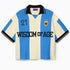 Wisdom Of Age Knit Soccer Jersey Celeste. Blue and beige striped Knitted Soccer Jersey with 'Wisdom of Age' text on a white background