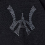Closer look at the brand logo in a monogram font of connecting the "W" and "A" located on the upper left chest of the cardigan.