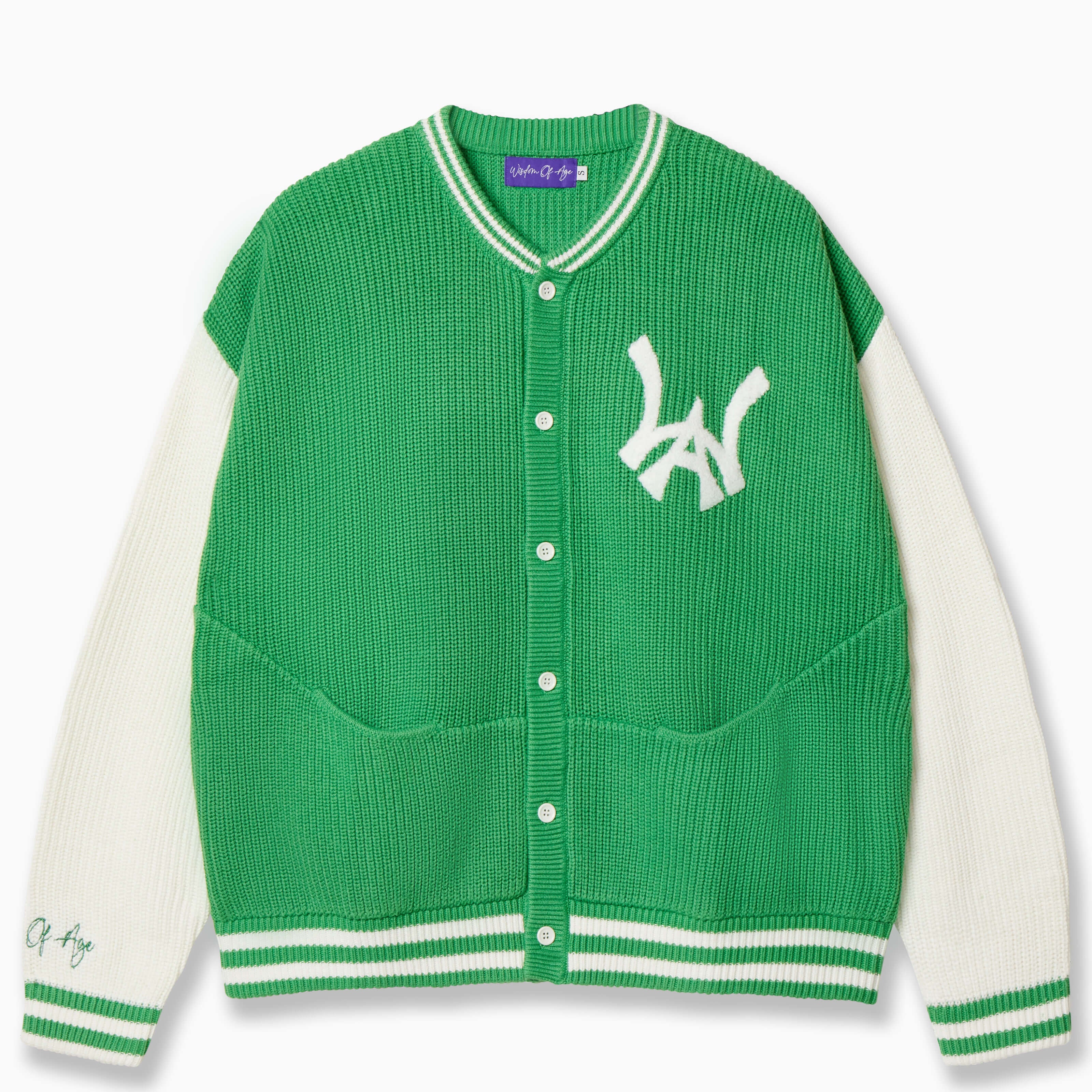 Wisdom of Age University Cardigan in Clover Green. With a varsity design and WA logo on the left chest and the brand name  “Wisdom of Age” written in script cursive on the right sleeve. Featuring a 5 button placket with dual seam slip-in pockets.