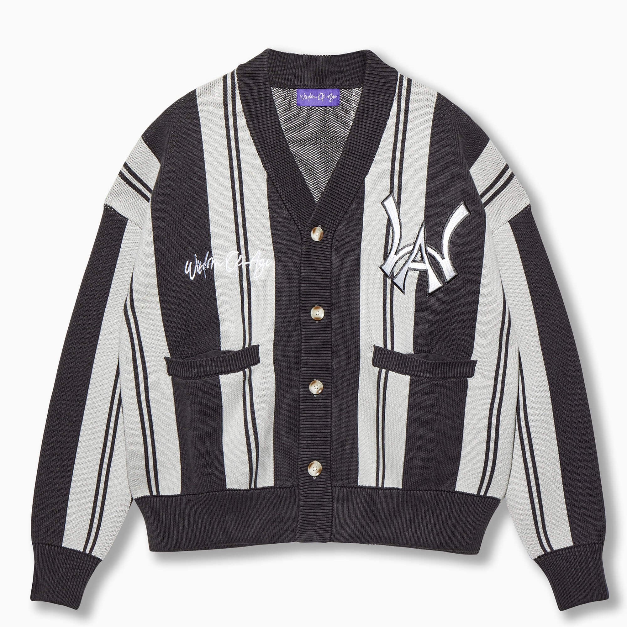 Wisdom of Age Shadow Grey City Cardigan. Monochrome shades of grey with the WA symbol on the top left side of the chest and the brand name “Wisdom of Age” written in script cursive on the right chest. Two slip-in pockets on both sides and a 4 button placket with a v-neck drop.