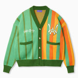 Wisdom of Age Orange and Mint Green Vertical Striped City Cardigan. A color blend of oranges and mint green with a symmetrical split of greens on the right side and a blend of oranges with some green on the left. The WOA symbol on the top left side of the chest and the brand name “Wisdom of Age” written in script cursive on the upper right chest. Two drop-in slip pockets on both sides and a 4 button placket with a v-neck drop.