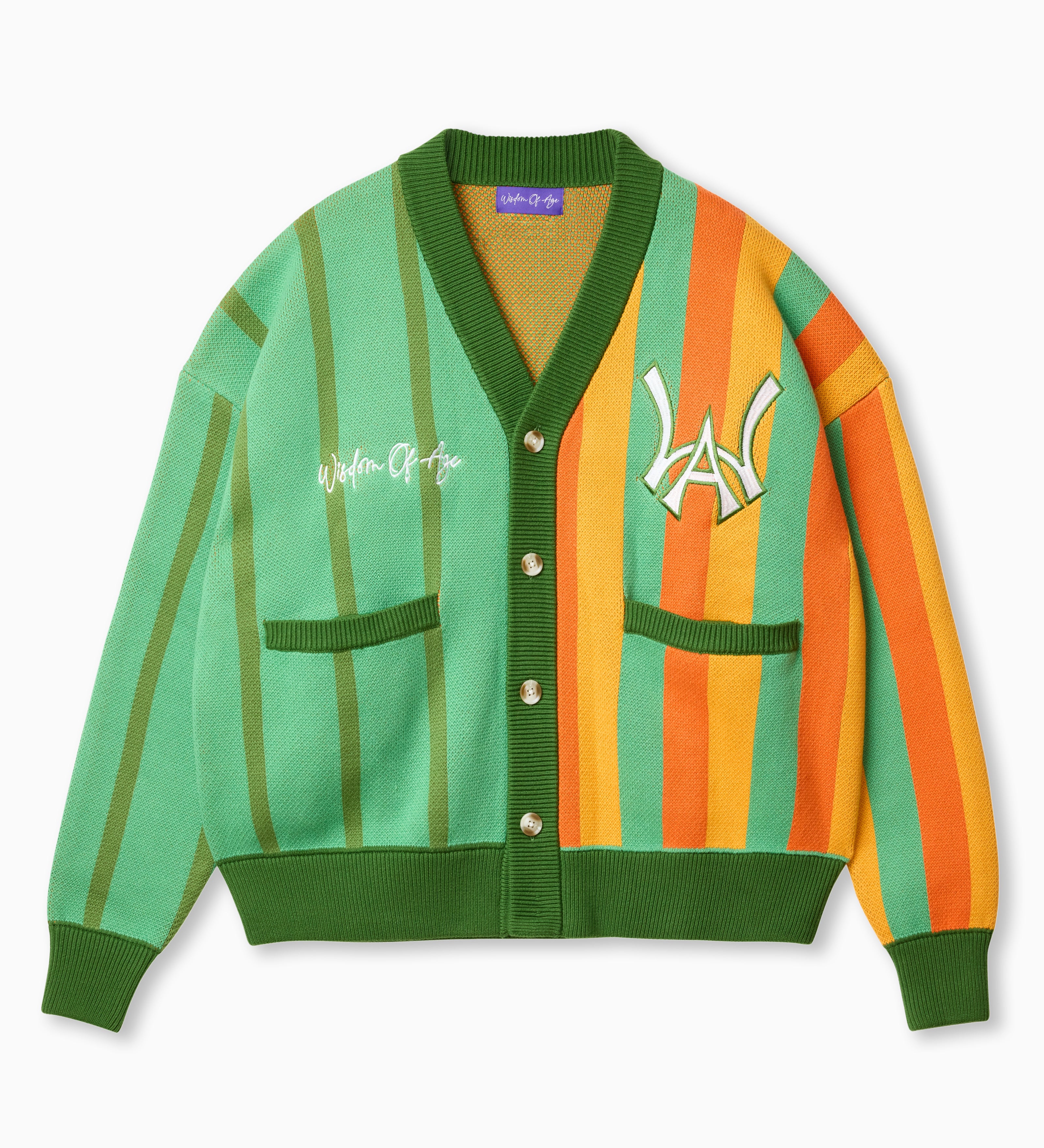Wisdom of Age Orange and Mint Green Vertical Striped City Cardigan. A color blend of oranges and mint green with a symmetrical split of greens on the right side and a blend of oranges with some green on the left. The WOA symbol on the top left side of the chest and the brand name “Wisdom of Age” written in script cursive on the upper right chest. Two drop-in slip pockets on both sides and a 4 button placket with a v-neck drop.