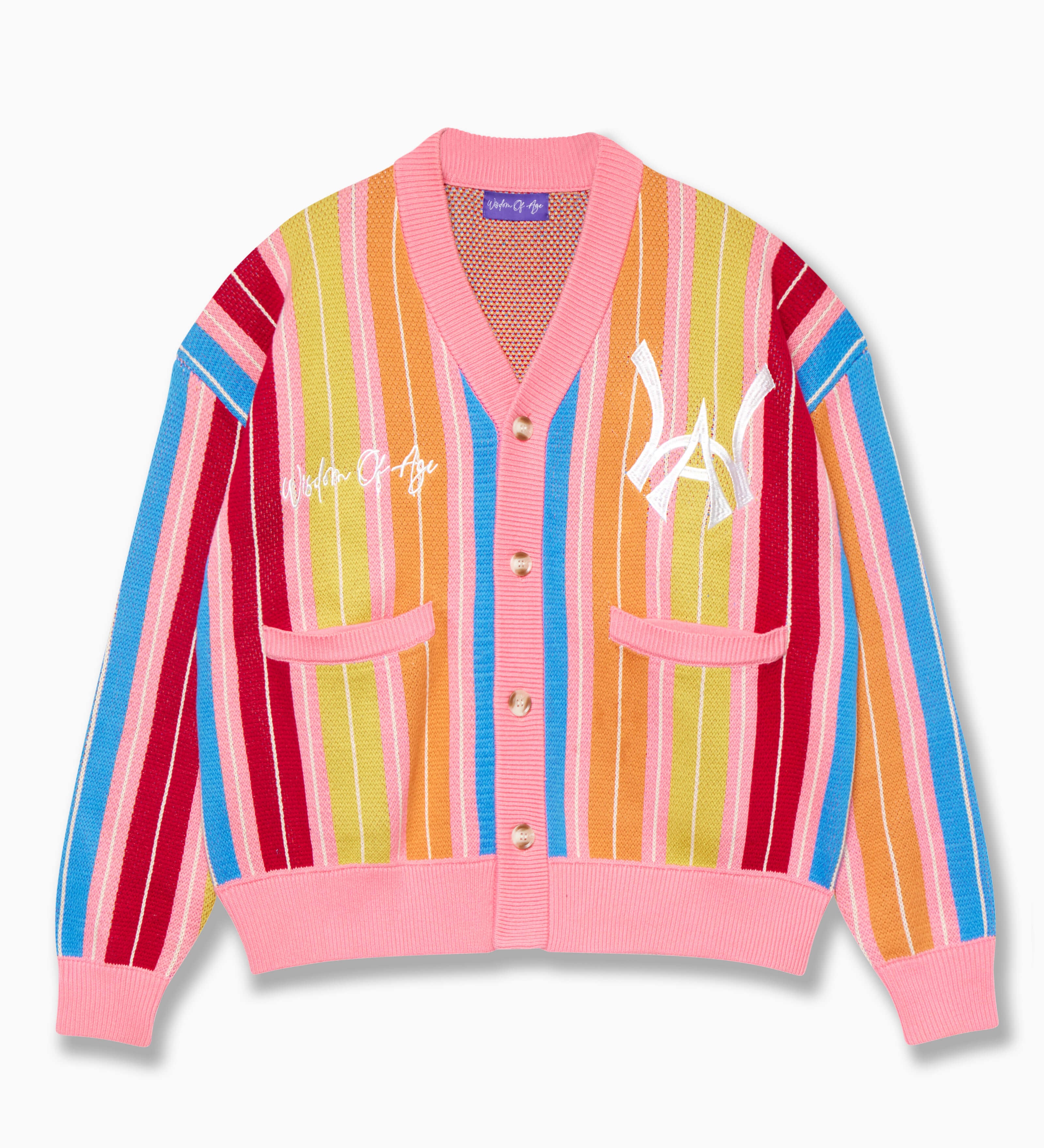 Wisdom of Age “What The?” City Cardigan.  Bubblegum pink base with blue, yellow, orange, red and white vertical stripes in bright hues. With the WA symbol on the top left side of the chest and the brand name “Wisdom of Age” written in script cursive on the right chest. Two slip-in pockets on both sides and a 4 button placket with a v-neck drop.