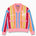 Wisdom of Age “What The?” City Cardigan.  Bubblegum pink base with blue, yellow, orange, red and white vertical stripes in bright hues. With the WA symbol on the top left side of the chest and the brand name “Wisdom of Age” written in script cursive on the right chest. Two slip-in pockets on both sides and a 4 button placket with a v-neck drop.
