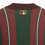 Closer look at the back of the sweater with an embroidered square patch below the nape of the neck and collar. The patch contains the upper half of the Statue of Liberty in a "NY Tough" inspired logo.