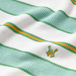 Close-up the WOA Knitted Shirt with green and white stripes and a logo.