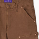Close Up Of WOA Canvas Carpenter Shorts in Brick with WOA brand label on a white background