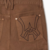 Close up of WOA Canvas Carpenter Shorts in Brick with WA logo on the right back pocket on a white background