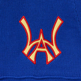 Close up of the front embroidered WA logo on the Wisdom Of Age Knit Football Jersey in Giant Blue