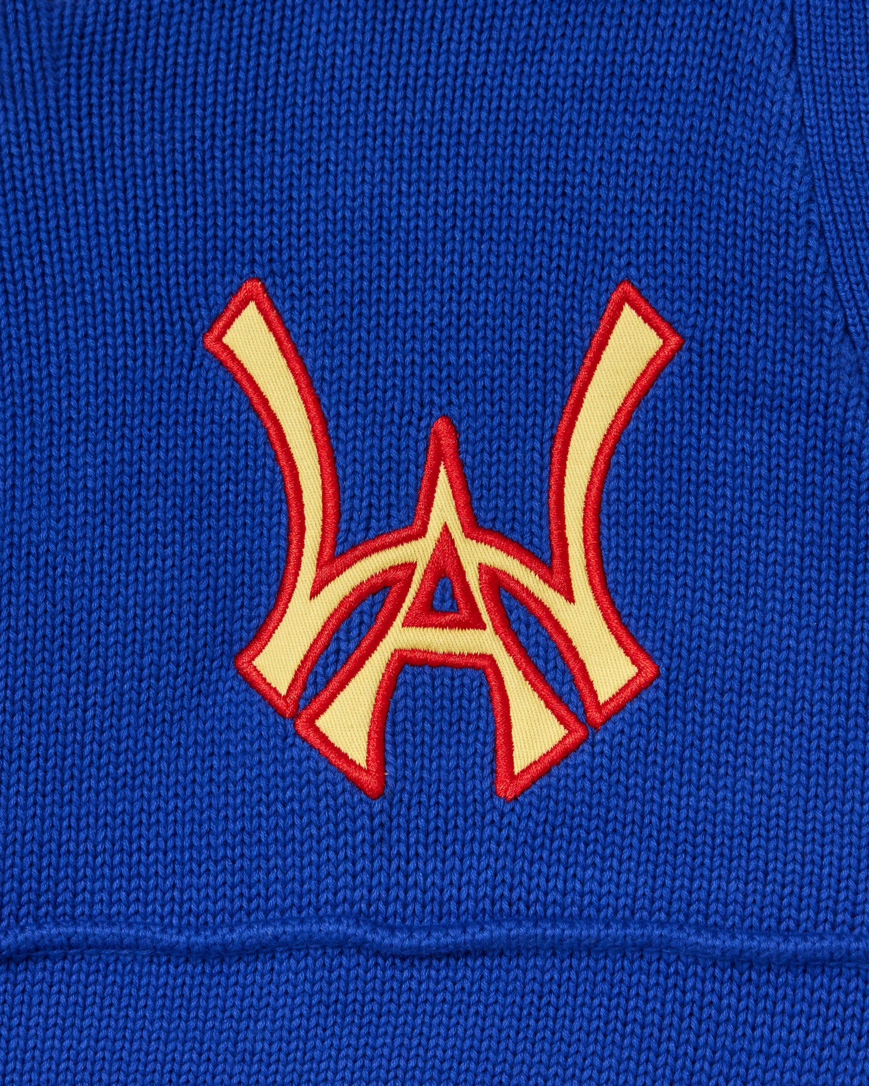 Close up of the front embroidered WA logo on the Wisdom Of Age Knit Football Jersey in Giant Blue