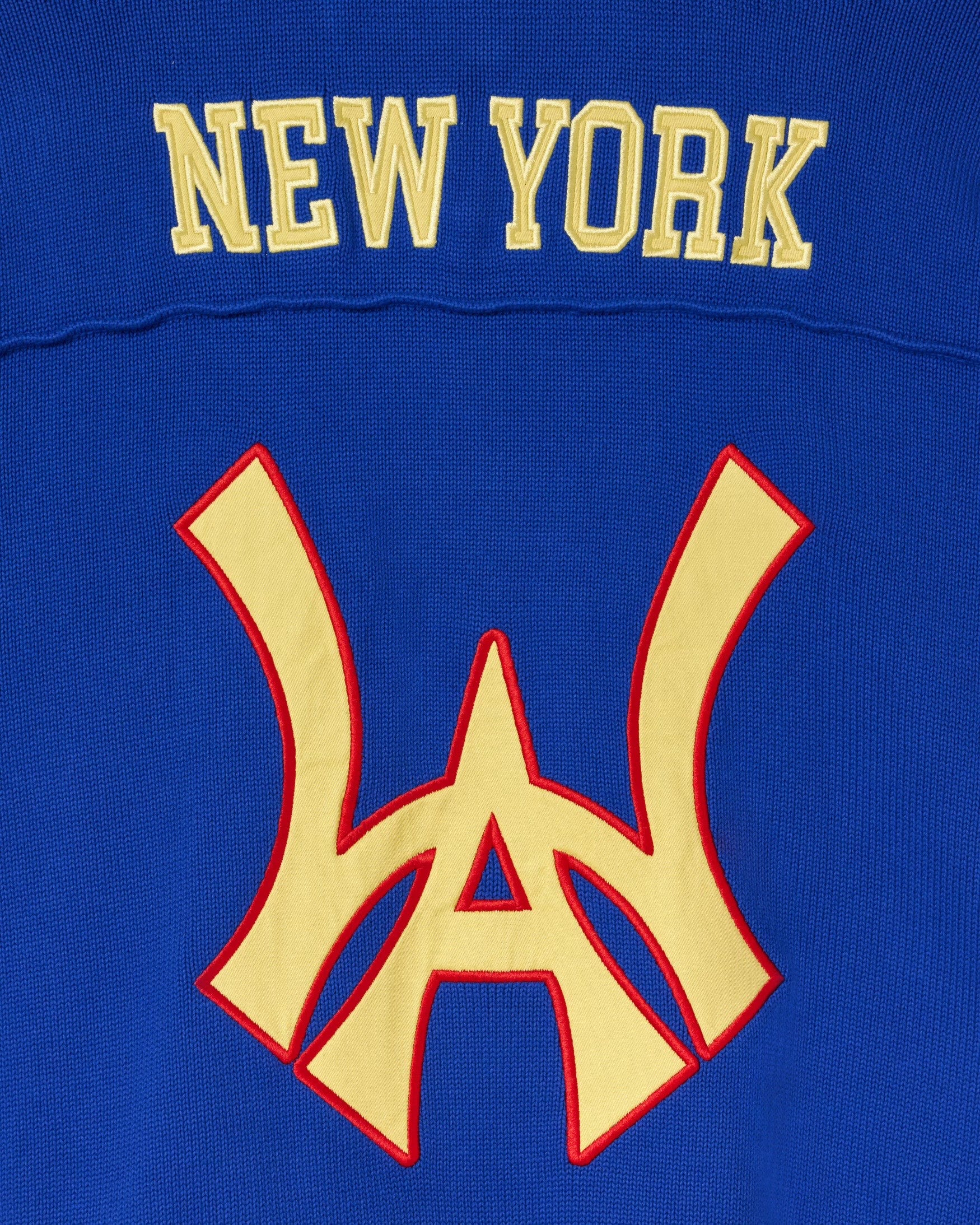Close up of the rear of the Wisdom Of Age Knit Football Jersey in Giant Blue