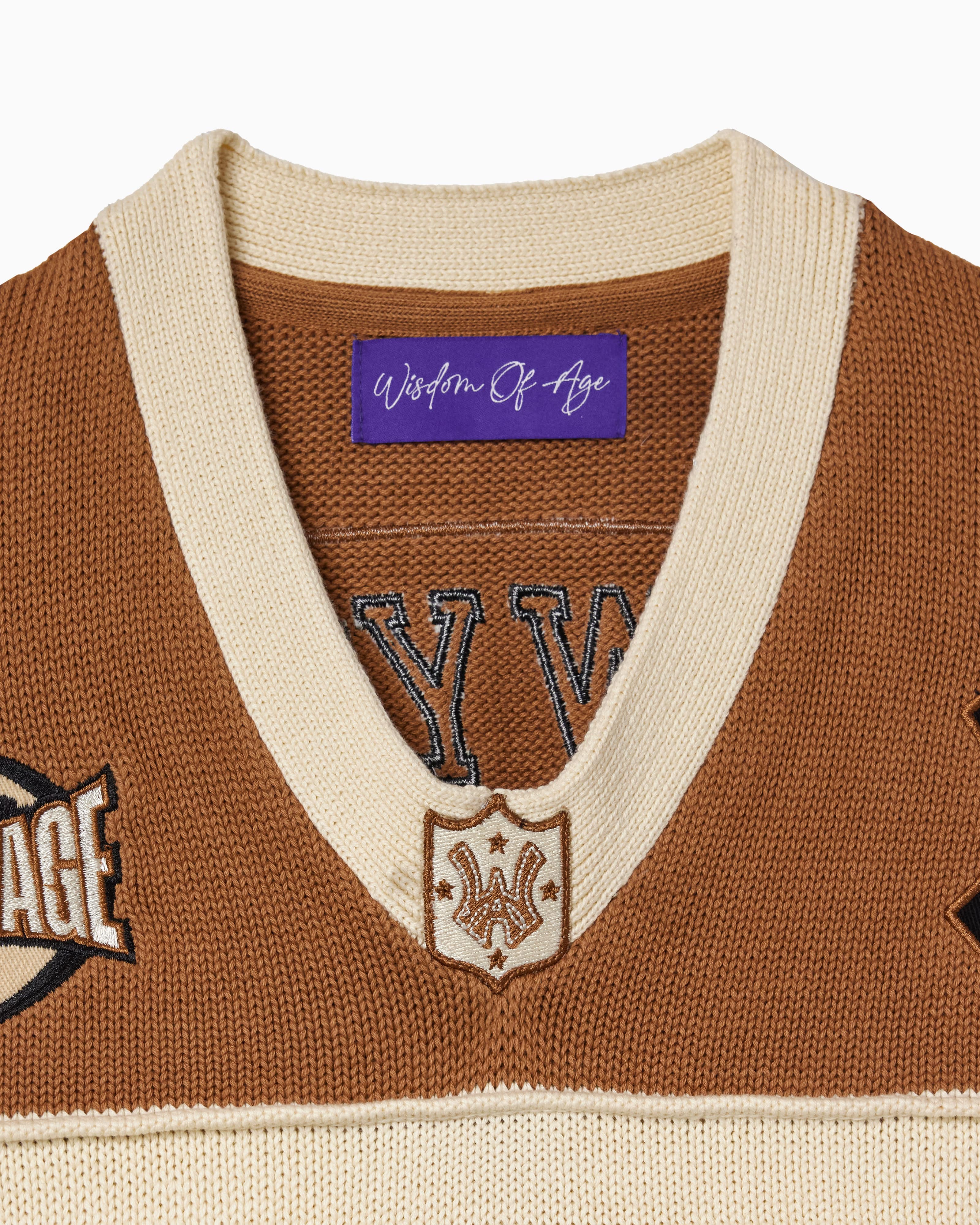 Close up the collar of the Wisdom Of Age Knit Football jersey V2 Sand
