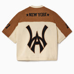 Back view of the Wisdom Of Age Knit Football jersey with 'New York'on the nameplate and the WA logo on a white background