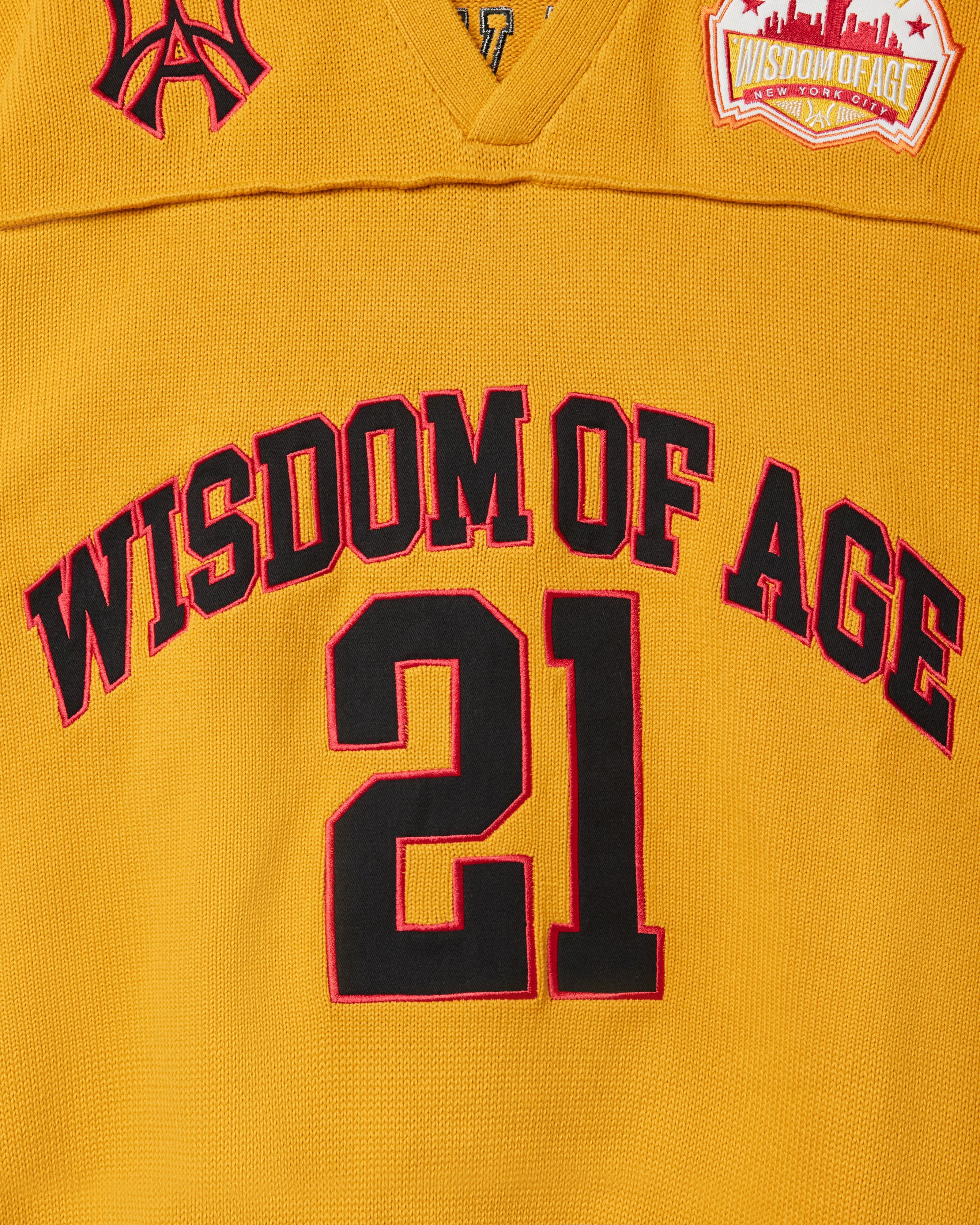 Wisdom Of Age Knit Football Jersey in Mustard - Front View close up
