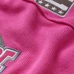 Close-up of the wisdom of age pink knitted football jersey 