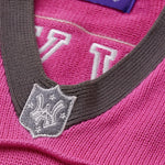 Close-up of the collar with an embroidered WA logo shield in charcoal.
